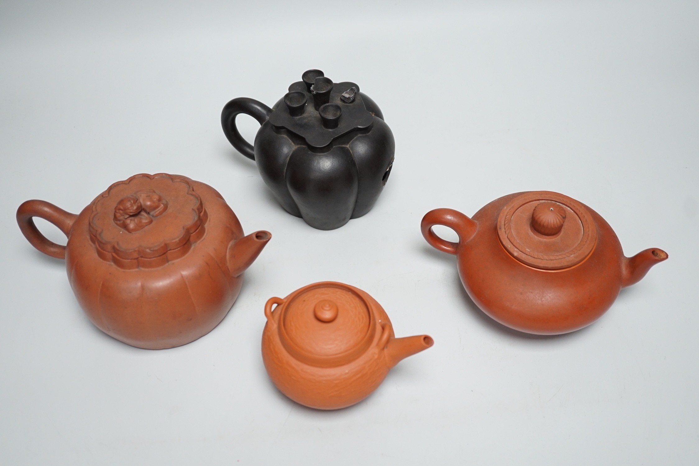 Four Chinese Yixing pottery teapots, tallest 10cm